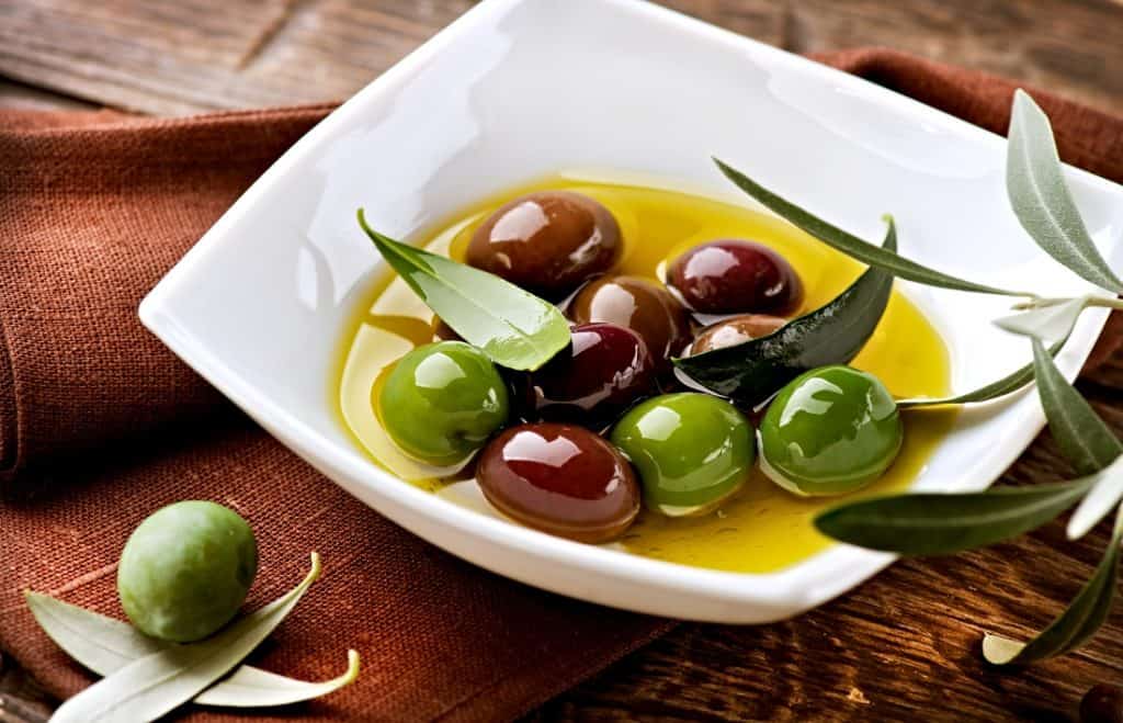 olives and olive oil in bowl