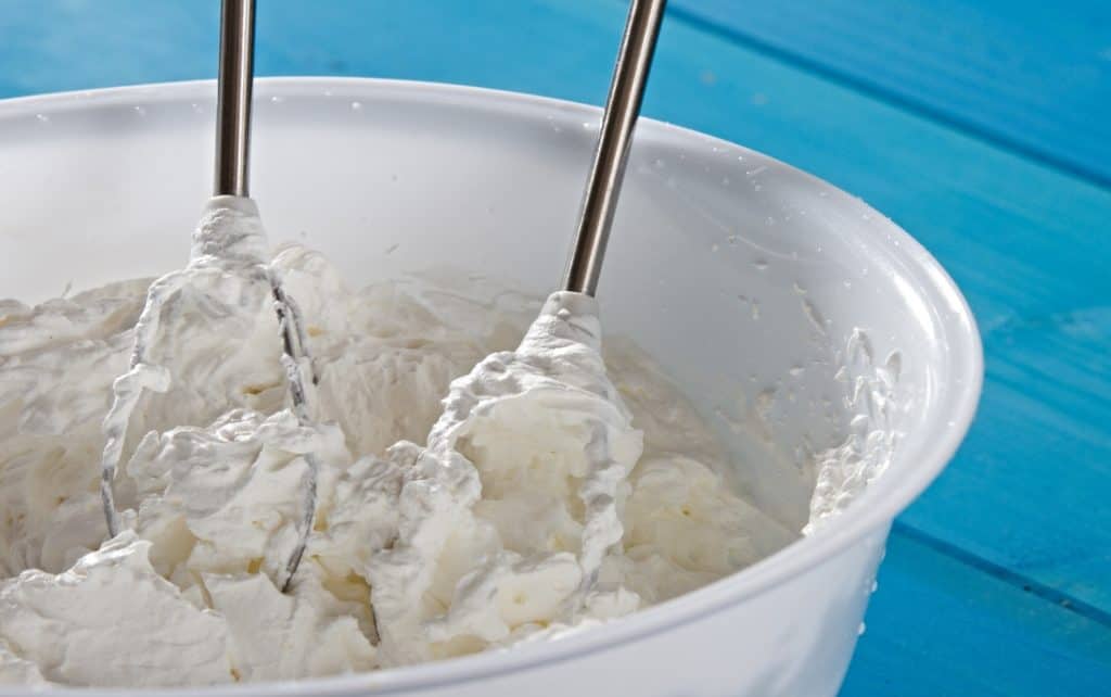 double whipped cream in mixing bowl