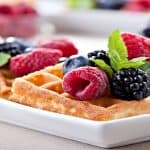 fruit and syrup topped waffles