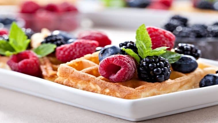 fruit and syrup topped waffles