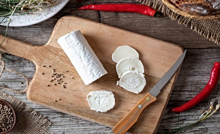 goat cheese on cutting board with other ingredients