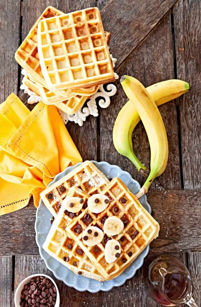 waffles topped with syrup banana and raisins