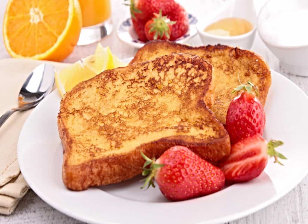 plate of French toast and fresh berries