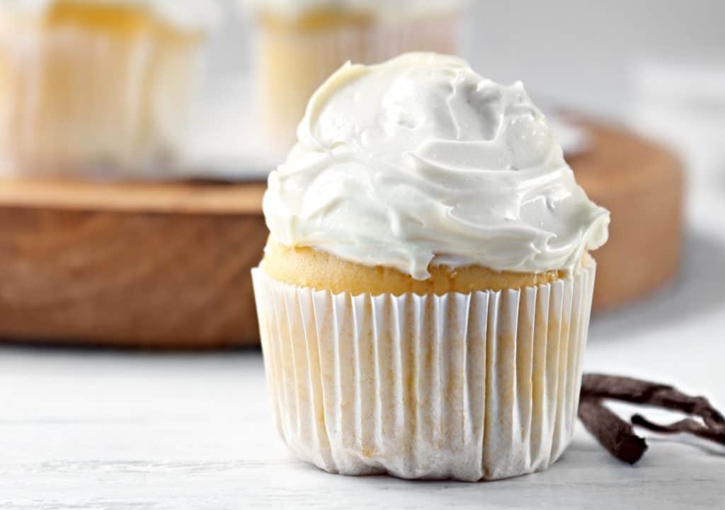 single cupcake with vanilla frosting closeup