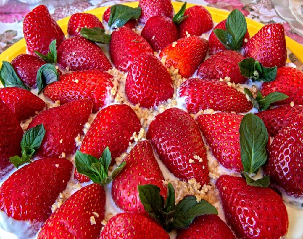 strawberry and cream topped cake