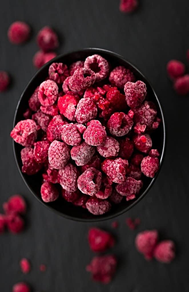 bowl of frozen raspberries viewed from above