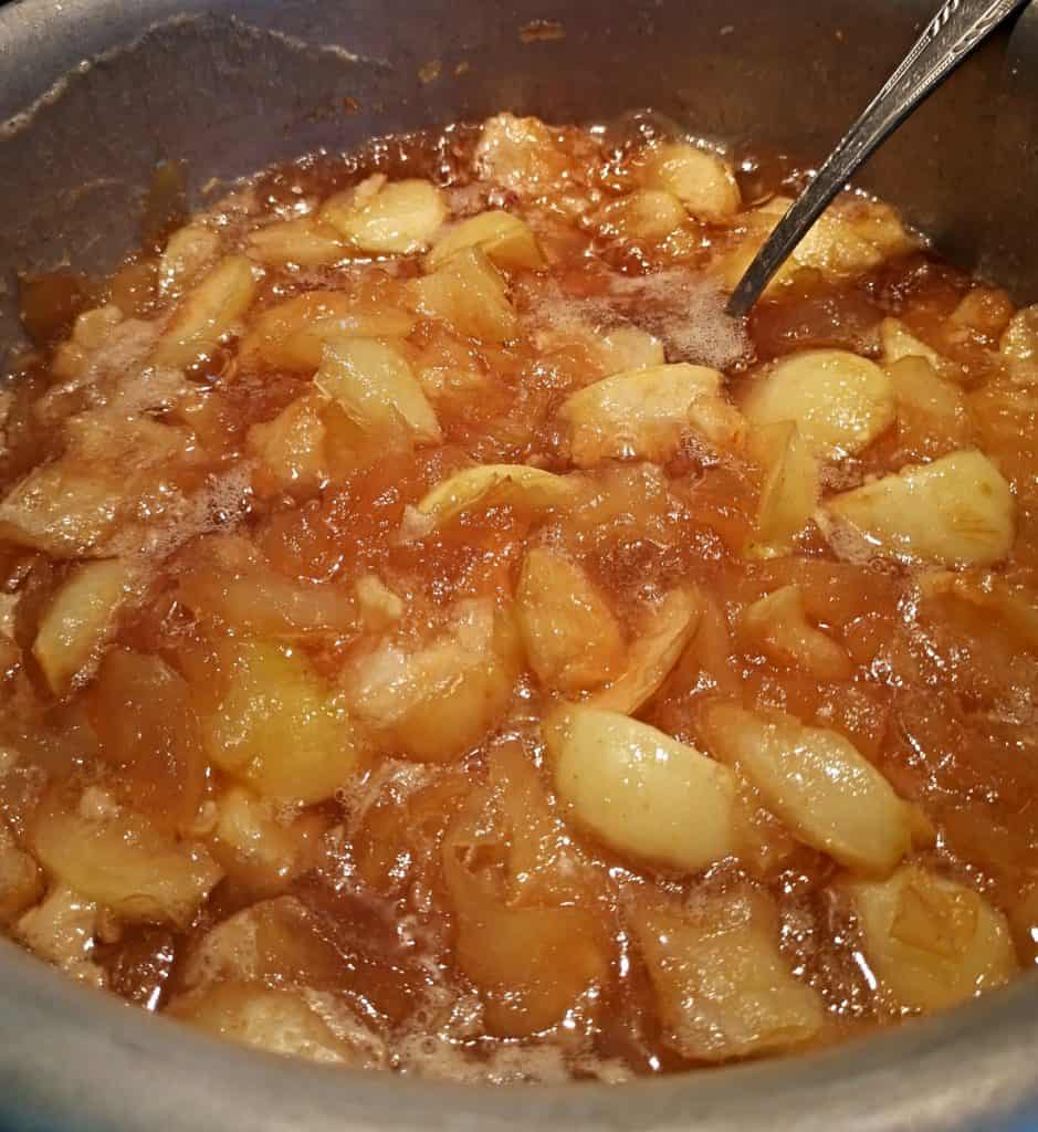 closeup of apple pie filling in saucepan