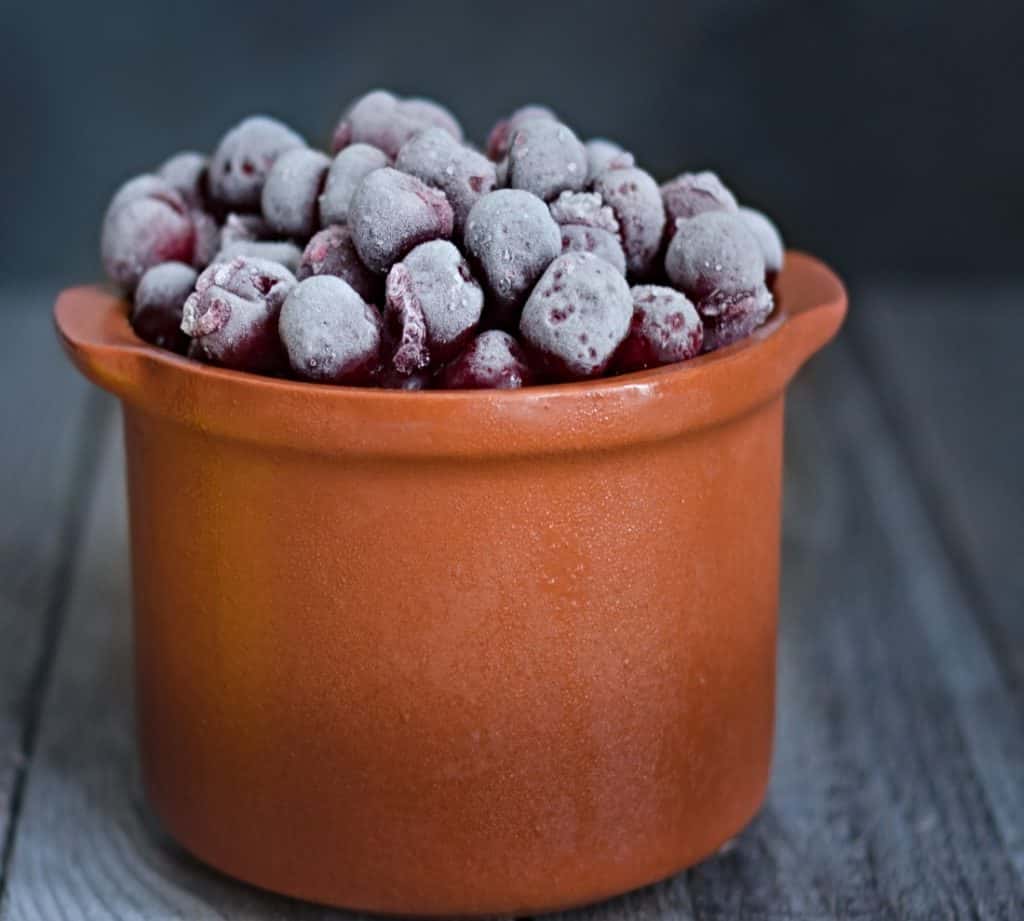 frozen cherries in ceramic container