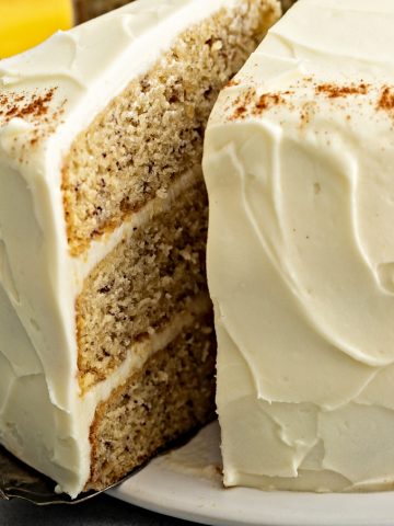 closeup of banana cake with a slice taken out