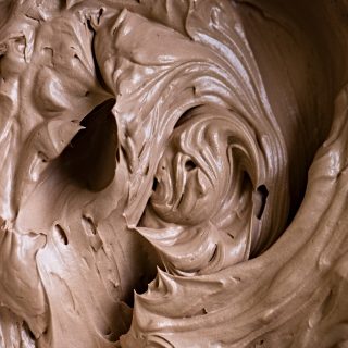 closeup of chocolate frosting for angel food cake