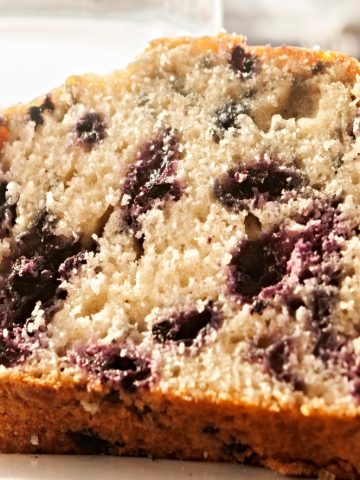 closeup of fresh slice of blueberry coffee cake