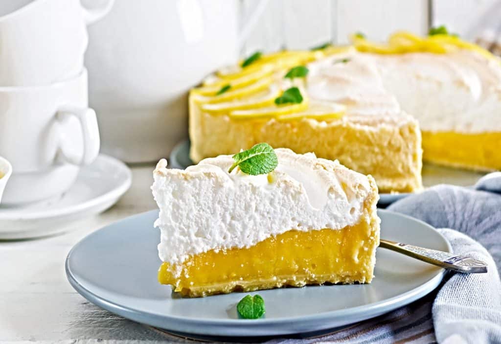 lemon pie with meringue topping on serving plate