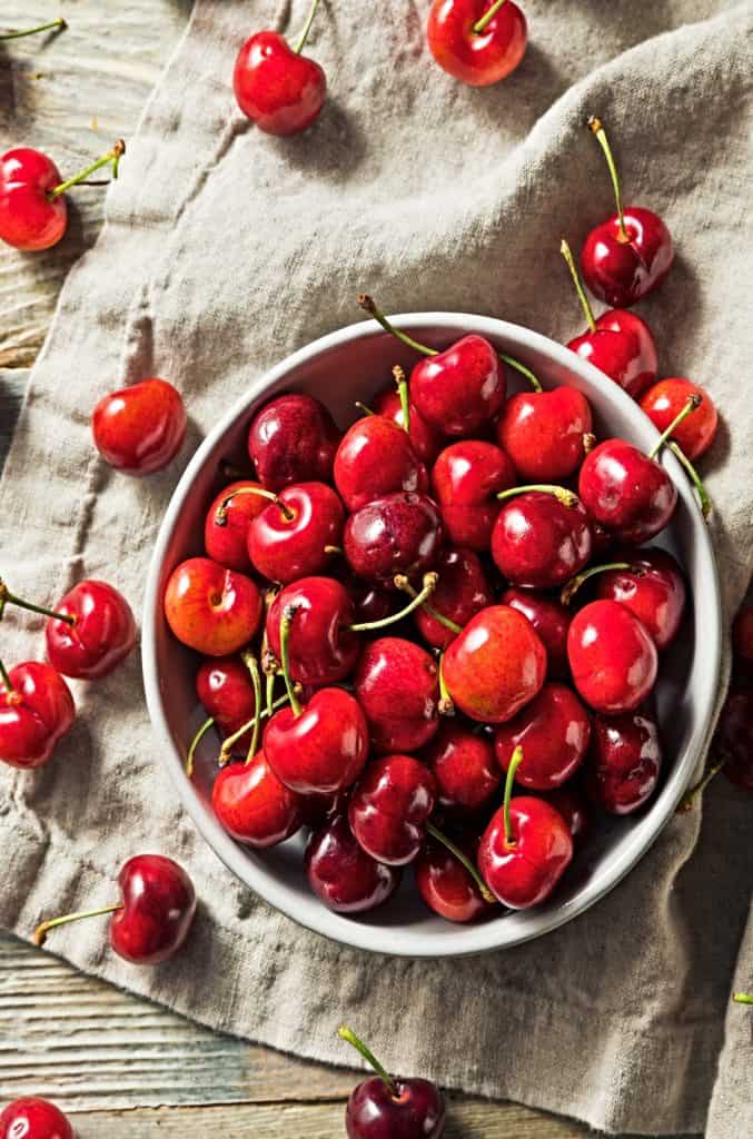 overhead picture of a bowl of fresh cherries